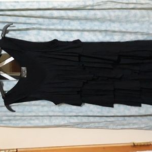Fun & flirty Little black dress. Layers of ruffles add pizazz. New without tags.